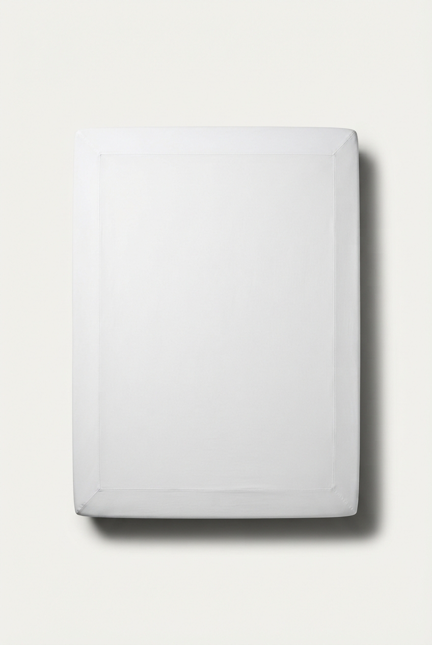 Smooth white queen mattress protector in neutral studio light